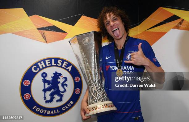 David Luiz of Chelsea poses for a photo with UEFA Europa League trophy in the changing room after the UEFA Europa League Final between Chelsea and...
