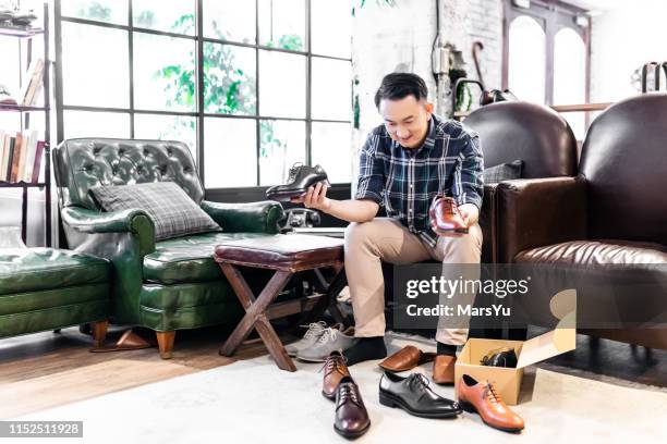 men trying different shoes - choosing shoes stock pictures, royalty-free photos & images