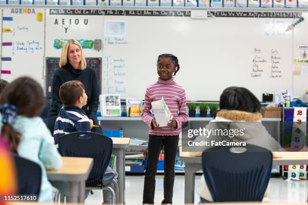 young african girl presenting to her class - stage fright stock pictures, royalty-free photos & images