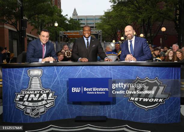 Network analysts Tony Luftman, Kevin Weekes, and Mike Rupp pose on the panel before Game Two of the 2019 NHL Stanley Cup Final between the St. Louis...