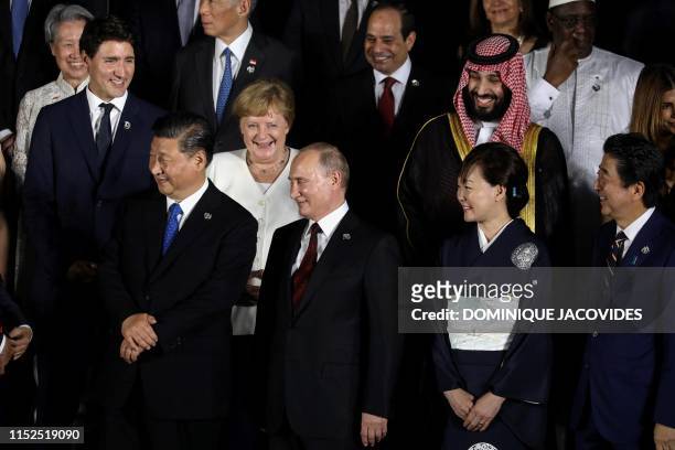Canadian Prime Minister Justin Trudeau, Chinese President Xi Jinping, German Chancellor Angela Merkel, Russian President Vladimir Putin, Japanese...