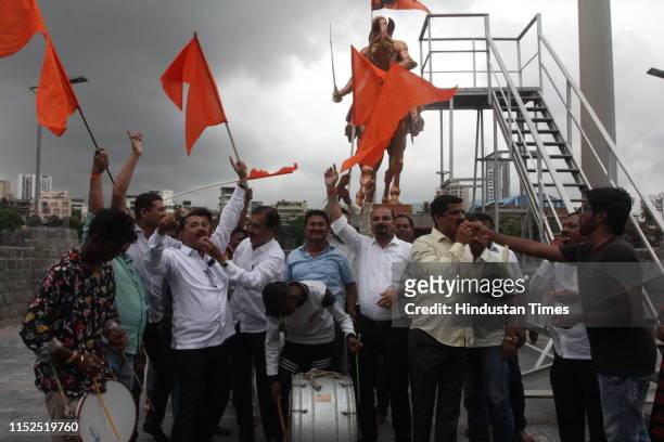 Members of the Maratha community distribute sweets as they celebrate the Bombay High Court nod to upheld the state government's decision to provide...