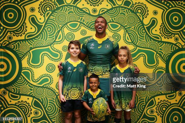 Kurtley Beale poses with children in the Wallabies Indigenous jersey to be worn at the 2019 Rugby World Cup during a Wallabies media opportunity at...