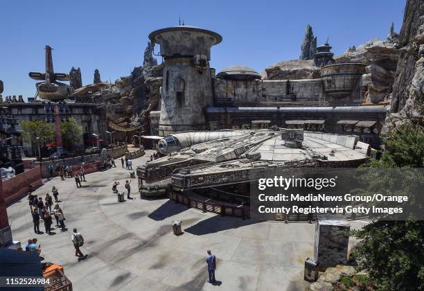 The Millennium Falcon sits outside the Millennium Falcon: Smugglers Run ride at Star Wars: Galaxy's Edge at Disneyland in Anaheim, CA, on Wednesday,...