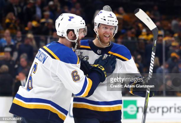 Carl Gunnarsson of the St. Louis Blues is congratulated by his teammate Joel Edmundson after scoring the game winning goal during the first overtime...