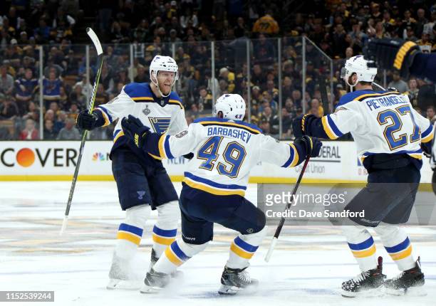 Carl Gunnarsson of the St. Louis Blues celebrates his overtime goal with teammates Ivan Barbashev and Alex Pietrangelo after he scored in overtime...