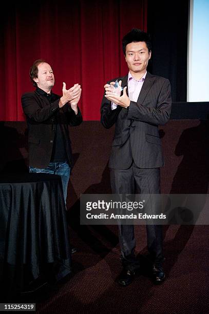 Animation director Chuck Sheetz presents an award to Heng Zhang at the UCLA Animation Workshop Festival of Animation at the James Bridges Theater at...