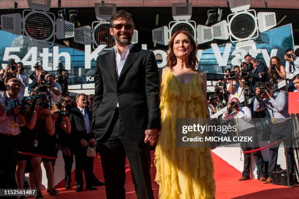 Actress Julianne Moore and her husband and US film director Bart Freundlich arrive for the start of the 54th Karlovy Vary International Film Festival...
