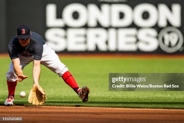 Brock Holt of the Boston Red Sox fields a ground ball during a team workout ahead of the 2019 Major League Baseball London Series on June 28, 2019 at...