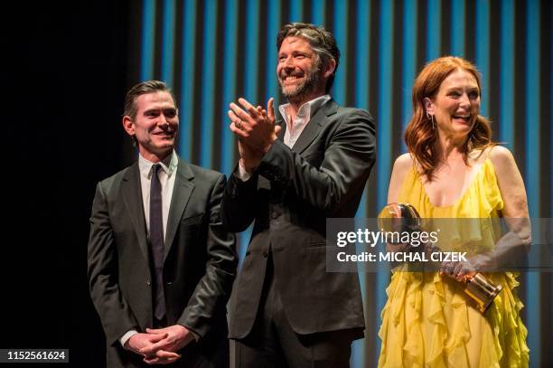 Actress Julianne Moore her husband US director Bart Freundlich and US actor Billy Crudup take the stage during the presentation of their film "after...