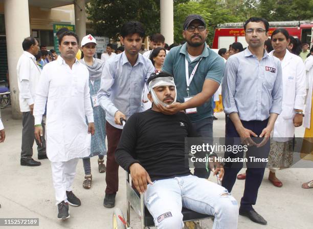 People during a mock earthquake rescue exercise, at Poly Clinic, sector 31 on June 28, 2019 in Gurugram, India. A mock scenario of an earthquake of...