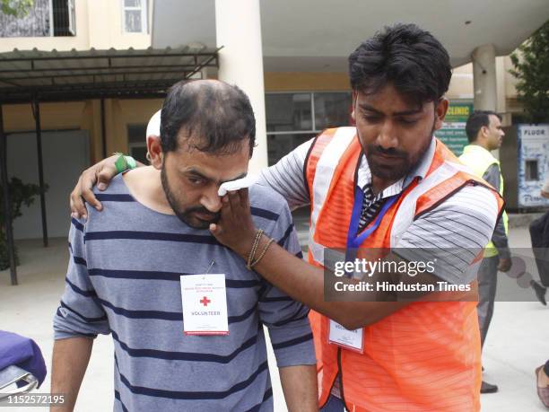 Volunteers during a mock earthquake rescue exercise, at Poly Clinic, sector 31 on June 28, 2019 in Gurugram, India. A mock scenario of an earthquake...