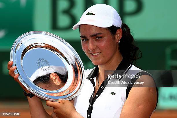 Champion Ons Jabeur of Tunisia poses with the trophy following her victory during the girl's singles final match between Ons Jabeur of Tunisia and...