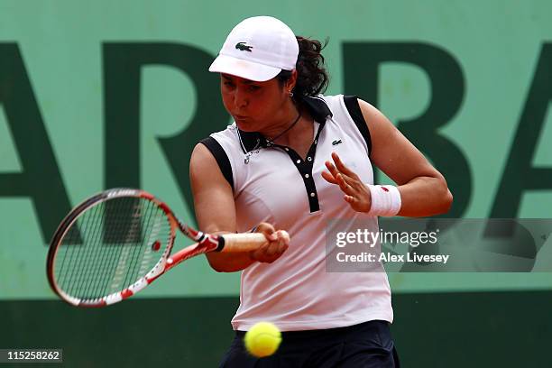 Ons Jabeur of Tunisia hits a forehand during the girl's singles final match between Ons Jabeur of Tunisia and Monica Puig of Puerto Rica on day...