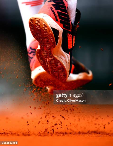 Detailed view of the shoes of Benoit Paire of France as he serves during his mens singles second round match against Pierre-Hugues Herbert of France...