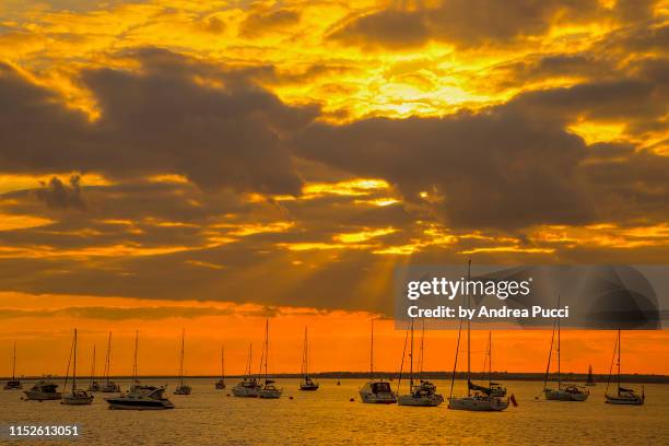 a sunset from yarmouth pier, isle of wight, united kingdom - yarmouth isle of wight stock pictures, royalty-free photos & images