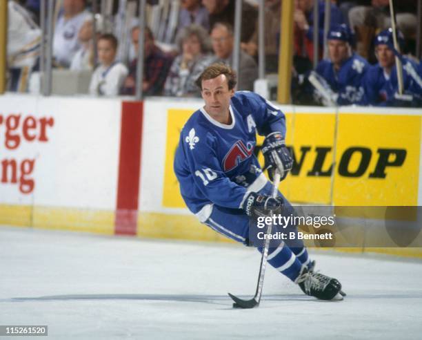 Guy Lafleur of the Quebec Nordiques skates with the puck during an NHL game against the Buffalo Sabres on March 28, 1991 at the Buffalo Memorial...