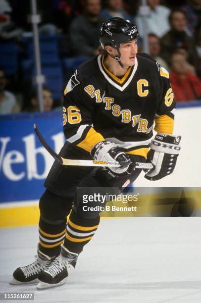 Mario Lemieux of the Pittsburgh Penguins skates on the ice during an NHL game circa 1993.