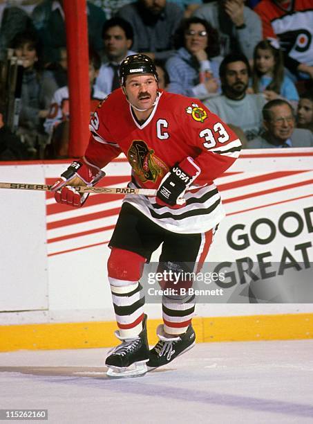 Dirk Graham of the Chicago Blackhawks skates on the ice during an NHL game against the Philadelphia Flyers circa 1990 at the Spectrum in...