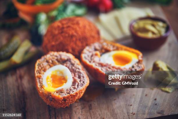 british scotch eggs with mustard - scotch egg stock pictures, royalty-free photos & images