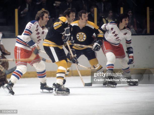 Phil Esposito and Ken Hodge of the Boston Bruins look for the pass while being defended by Rod Seiling and Jim Neilson of the New York Rangers circa...