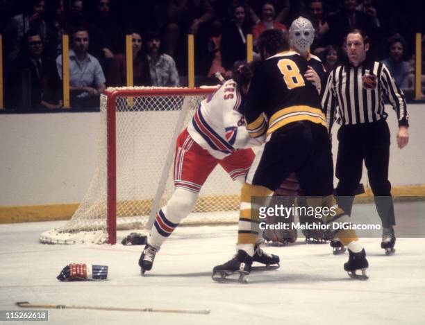 Ken Hodge of the Boston Bruins fights with Steve Vickers of the New York Rangers during their game circa 1973 at the Madison Square Garden in New...