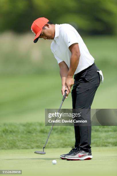 Pan of Taiwan hits a putt on the 11th hole during the second round of the 2019 PGA Championship on the Black Course at Bethpage State Park on May 17,...