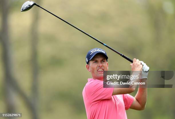 Webb Simpson of the United States hits his tee shot on the 12th hole during the second round of the 2019 PGA Championship on the Black Course at...