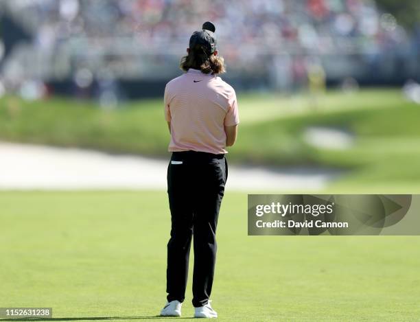 Tommy Fleetwood of England plays his second shot on the 12th hole during the third round of the 2019 PGA Championship on the Black Course at Bethpage...