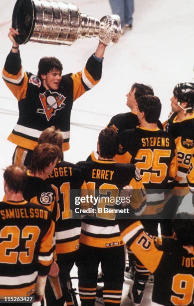 Jaromir Jagr of the Pittsburgh Penguins skates with the Stanley Cup after Game 6 of the 1991 Stanley Cup Finals against the Minnesota North Stars on...