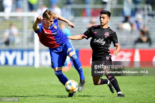 Bastien Conus of FC Basel is challenged by Ray Serrano Lopez of Seattle Sounders FC in the group stage match between Seattle Sounders FC and FC Basel...