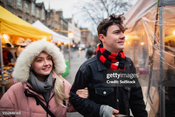 walking through the street markets - edinburgh rain stock pictures, royalty-free photos & images