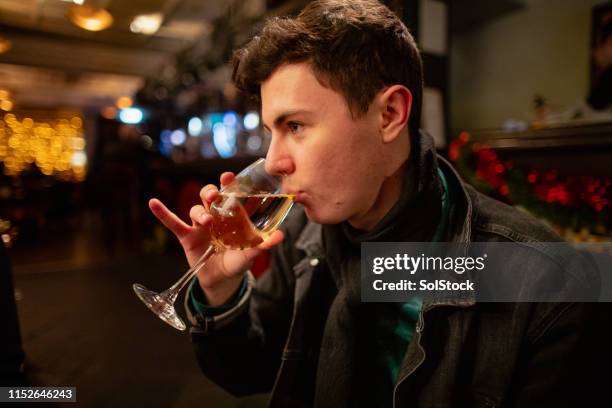enjoying a drink at christmas - little finger stock pictures, royalty-free photos & images