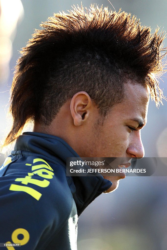 Brazilian footballer Neymar waves during