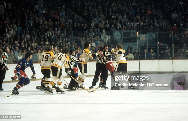 Brad Park of the New York Rangers tries to fight Terry O'Reilly of the Boston Bruins as Carol Vadnais, Fred O'Donnell and Gregg Sheppard of the...