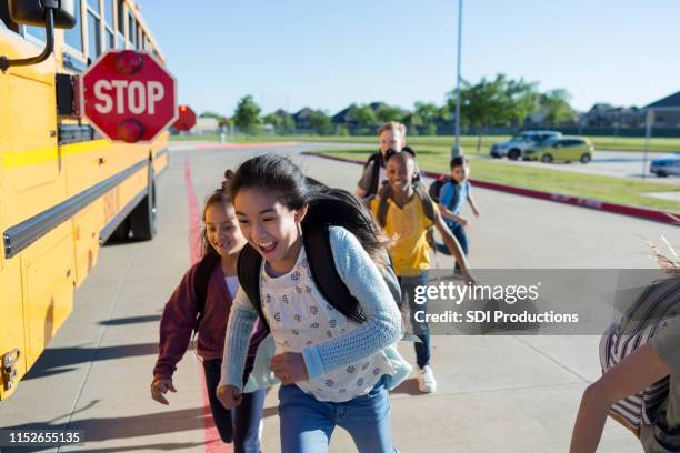 when safety signs are lit, children are safe - school bus kids stock pictures, royalty-free photos & images