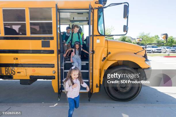 school children exit school bus - leaving stock pictures, royalty-free photos & images