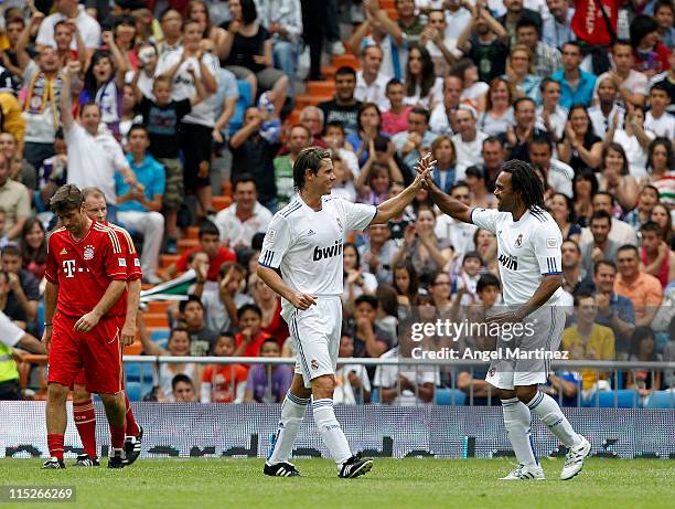 Fernando Redondo of Real Madrid celebrates with Christian Karembeu after scoring during the Corazon Classic Match between Allstars Real Madrid and...
