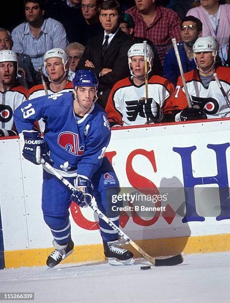 Joe Sakic of the Quebec Nordiques skates with the puck during an NHL game against the Philadelphia Flyers on October 18, 1990 at the Spectrum in...