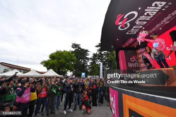 Podium / Richard Carapaz of Ecuador and Movistar Team Pink Leader Jersey / Celebration / Flowers / Press / Media / Photographers / during the 102nd...