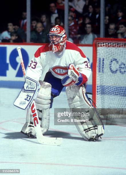 Goalie Patrick Roy of the Montreal Canadiens defends the net during an NHL game circa 1994 at the Montreal Forum in Montreal, Quebec, Canada.