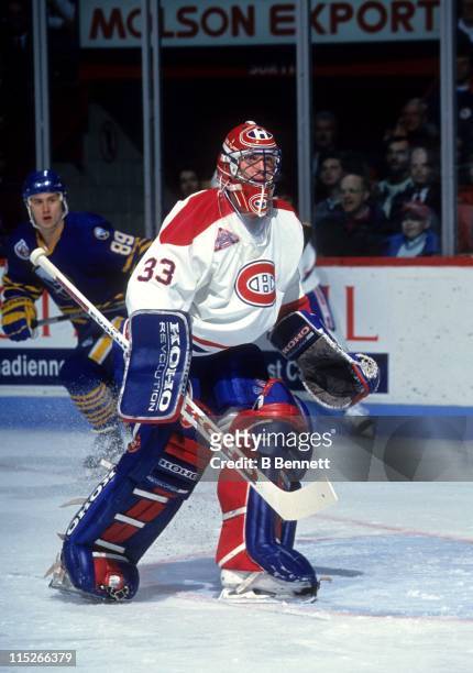 Goalie Patrick Roy of the Montreal Canadiens defends the net during an NHL game against the Buffalo Sabres circa 1990 at the Montreal Forum in...