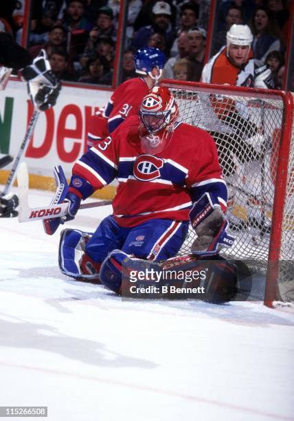Goalie Patrick Roy of the Montreal Canadiens makes the save during an NHL game against the Philadelphia Flyers on March 20, 1995 at the Spectrum in...