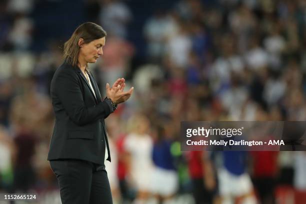 Dejected The head coach / manager of France Corinne Diacre applauds the fans at full time during the 2019 FIFA Women's World Cup France Quarter Final...