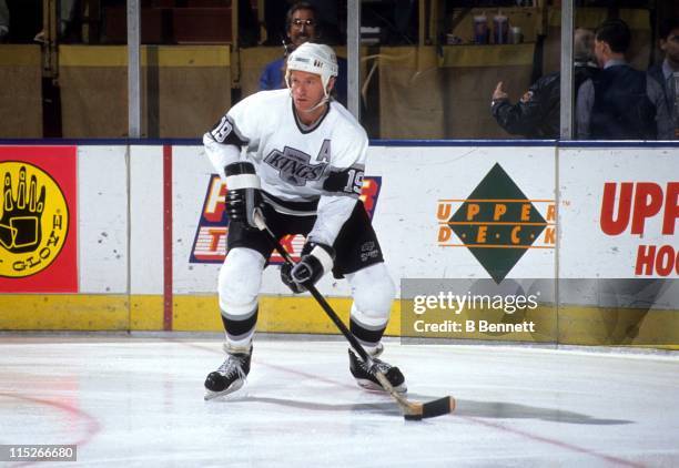 Larry Robinson of the Los Angeles Kings skates with the puck during an NHL game circa 1989 at the Great Western Forum in Inglewood, California.