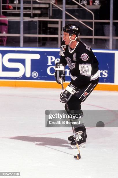 Larry Robinson of the Los Angeles Kings skates with the puck during an NHL game against the New York Rangers on October 23, 1991 at the Madison...