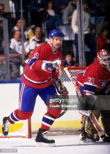 Larry Robinson of the Montreal Canadiens skates on the ice as goalie Patrick Roy looks on during an NHL game circa 1987.