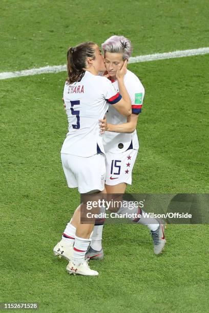 Kelley O'Hara of USA kisses Megan Rapinoe on the cheek as they celebrate their 2nd goal during the 2019 FIFA Women's World Cup France Quarter Final...