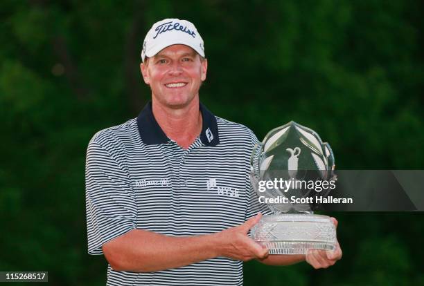 Steve Stricker poses with the trophy after winning the Memorial Tournament presented by Nationwide Insurance at the Muirfield Village Golf Club on...