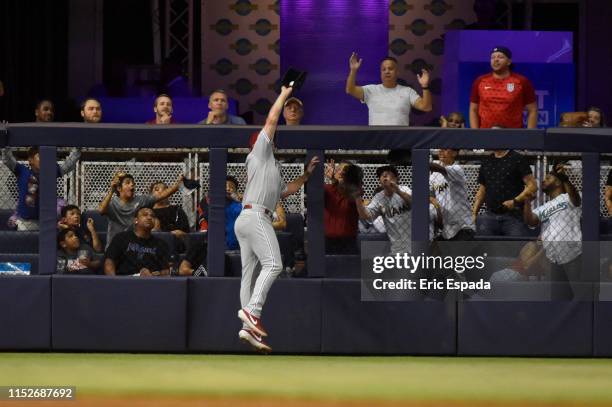 Jay Bruce of the Philadelphia Phillies robs Neil Walker of the Miami Marlins of a home run in the sixth inning of the game at Marlins Park on June...